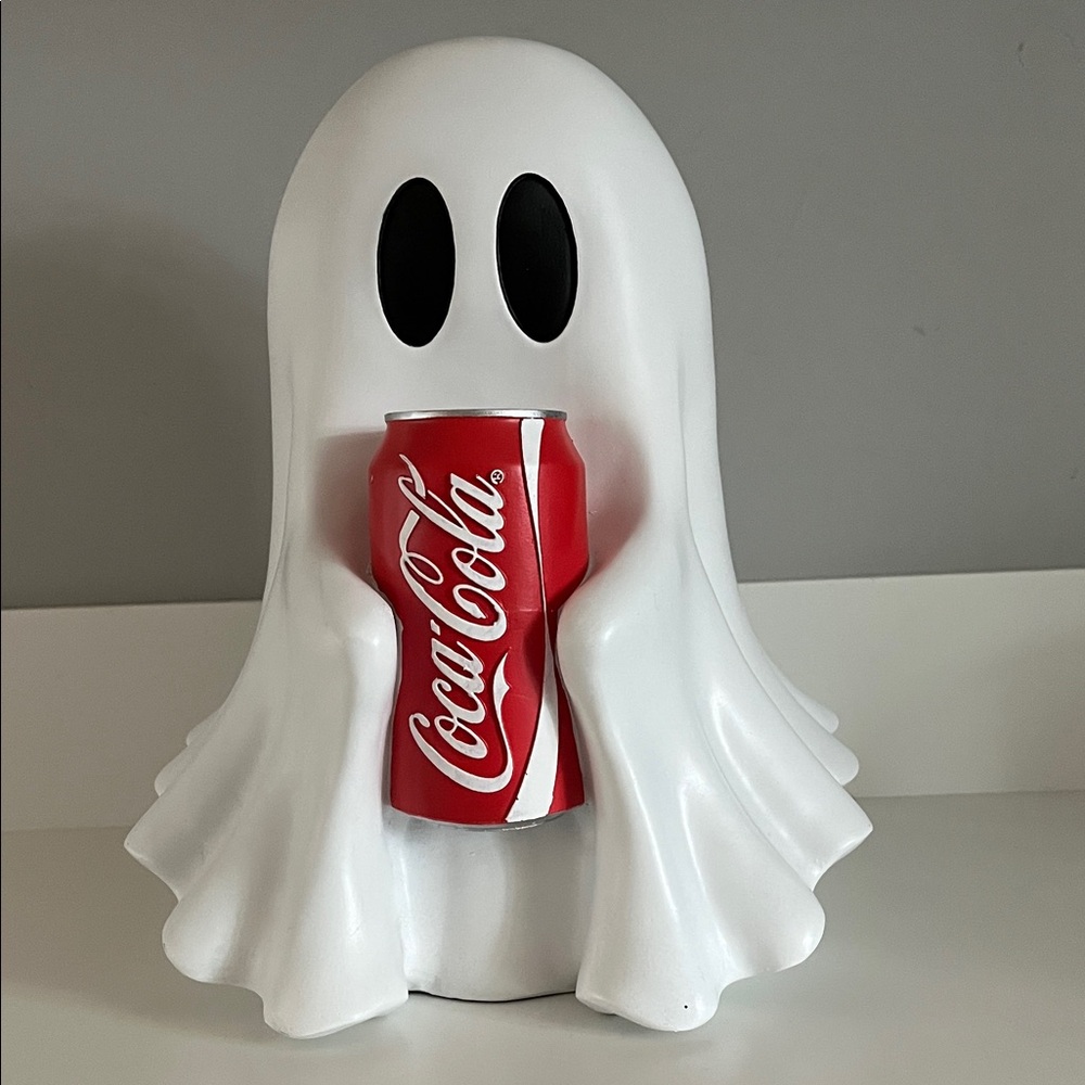 Ghost holding Coca Cola Red Can with White Ghost Holder